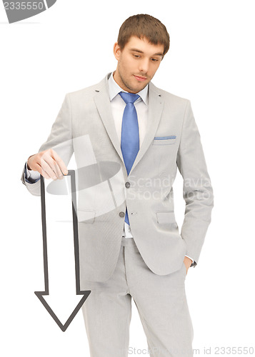 Image of businessman with direction arrow sign