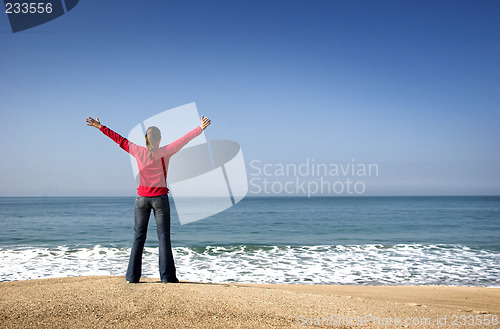 Image of Young woman in the beach