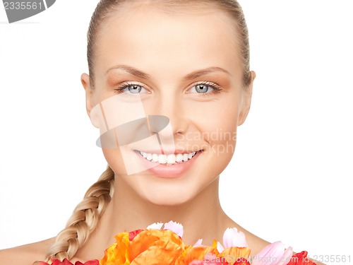 Image of lovely woman with red flowers