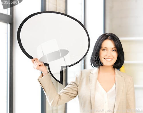 Image of smiling businesswoman with blank text bubble