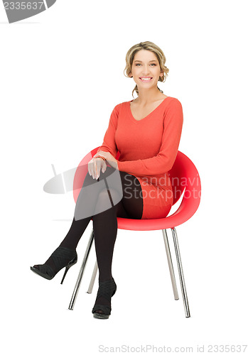 Image of young businesswoman sitting in chair