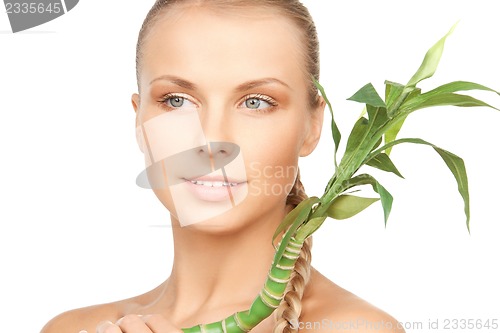 Image of woman with green sprout