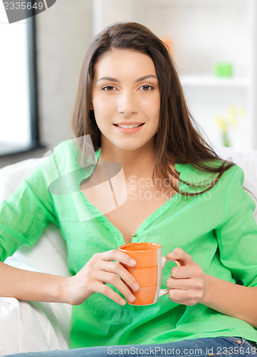 Image of lovely woman with mug