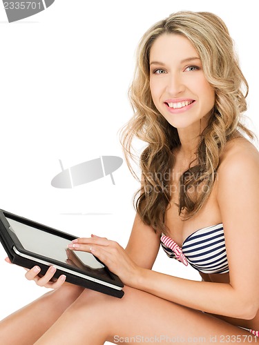 Image of woman in bikini with tablet pc computer