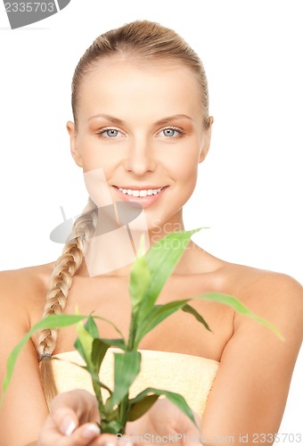 Image of woman with green sprout