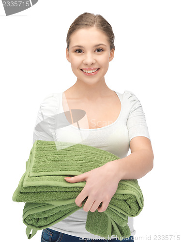 Image of lovely housewife with towels