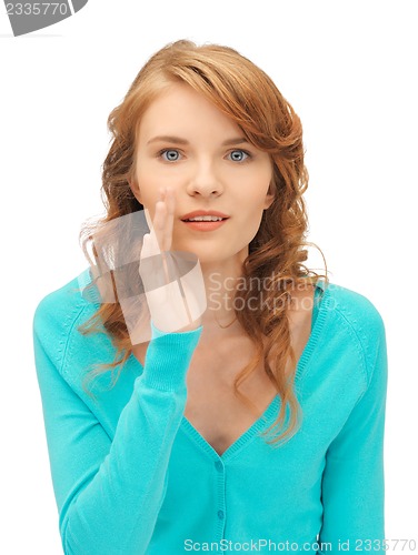 Image of teenage girl whispering gossip