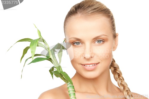Image of woman with green sprout