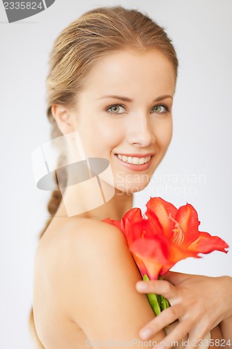 Image of lovely woman with lily flower