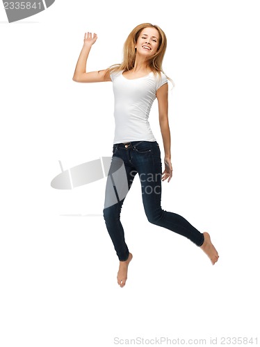 Image of jumping teenage girl in blank white t-shirt