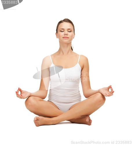 Image of woman practicing yoga lotus pose