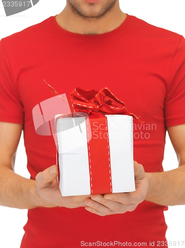 Image of man's hands holding gift box