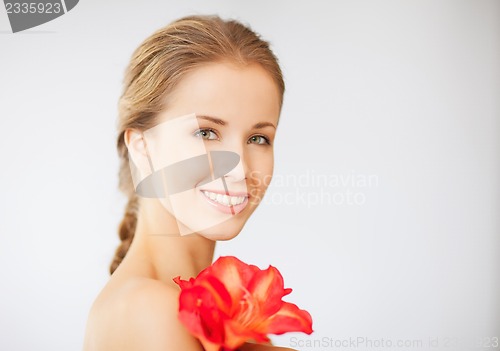 Image of lovely woman with lily flower