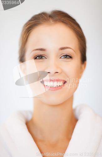 Image of beautiful woman in bathrobe