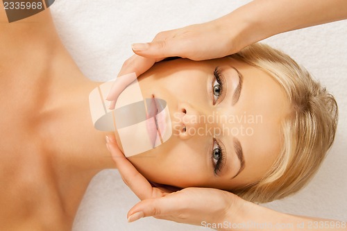 Image of beautiful woman in massage salon