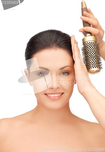 Image of beautiful woman with comb