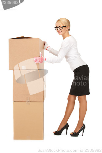 Image of businesswoman with big boxes