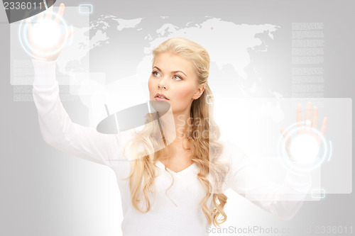 Image of businesswoman working with touch screen