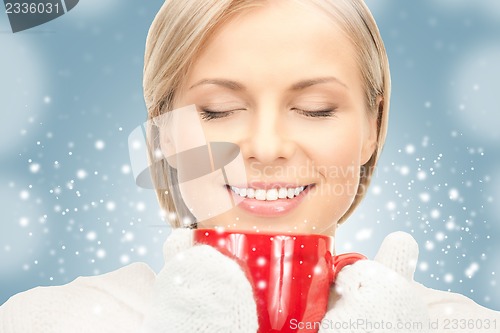 Image of beautiful woman with red mug