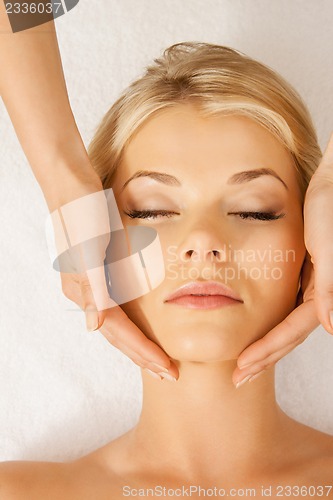 Image of beautiful woman in massage salon