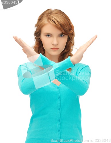 Image of young woman making stop gesture