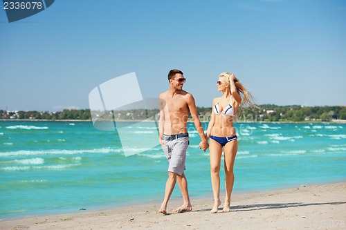 Image of couple walking on the beach