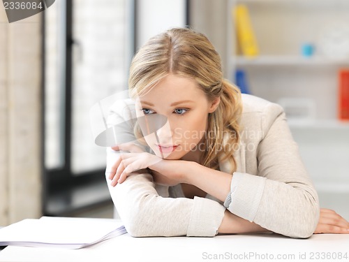 Image of unhappy woman in office