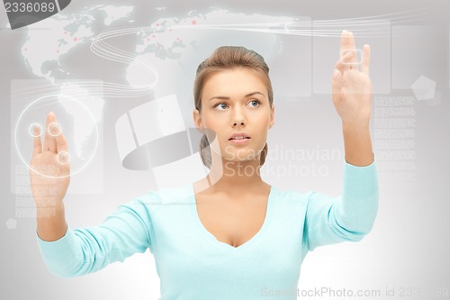 Image of businesswoman working with touch screen