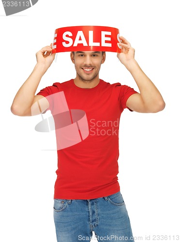 Image of handsome man with sale sign