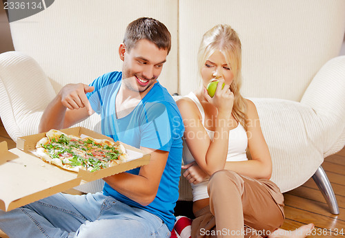 Image of couple eating different food