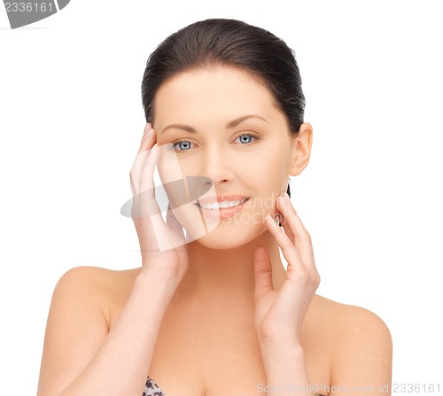 Image of face and hands of beautiful woman