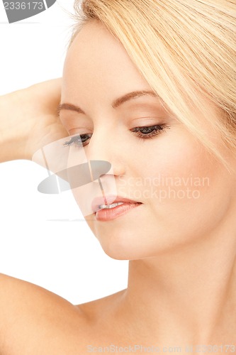 Image of face and hands of beautiful woman