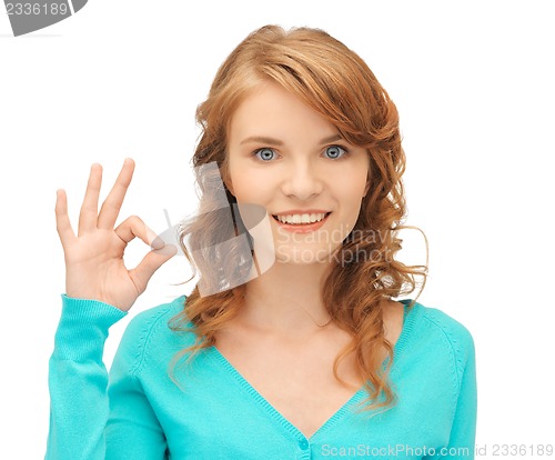 Image of teenage girl showing ok sign