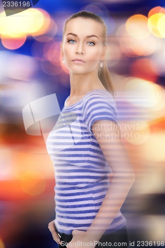 Image of lovely woman over city lights