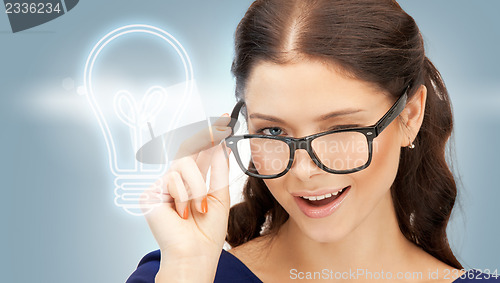 Image of happy and smiling woman in specs