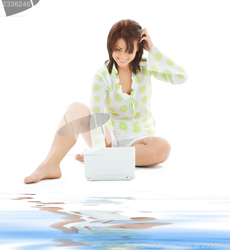 Image of happy woman with laptop computer