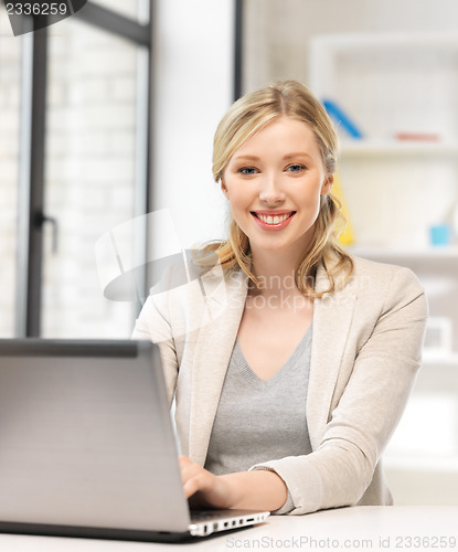 Image of happy woman with laptop computer