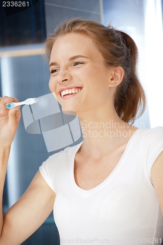 Image of smiling teenage girl with toothbrush