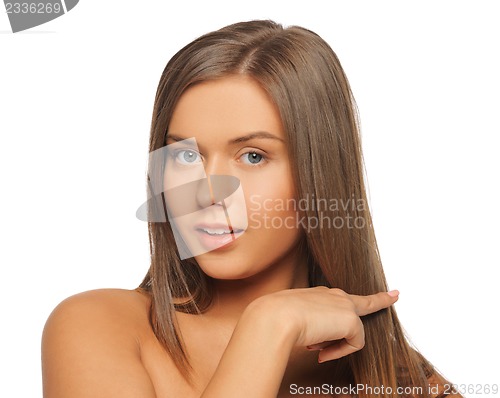 Image of beautiful woman touching her hair