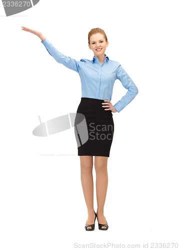 Image of smiling stewardess showing direction