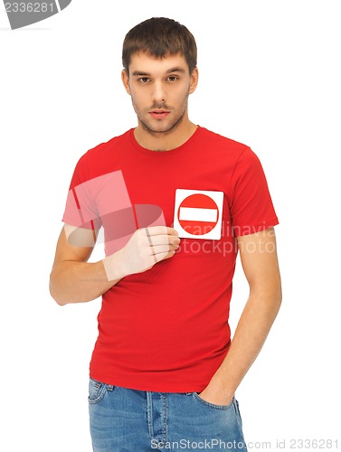 Image of man holding no entry sign on the heart