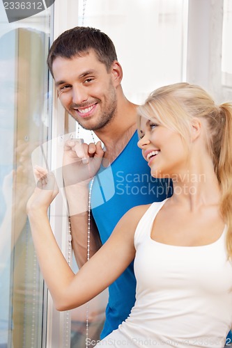 Image of happy couple at the window