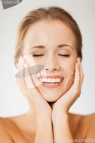 Image of face and hands of beautiful woman