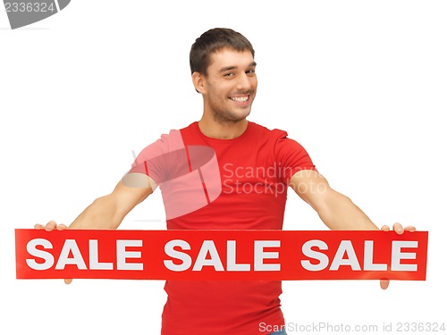 Image of handsome man with sale sign