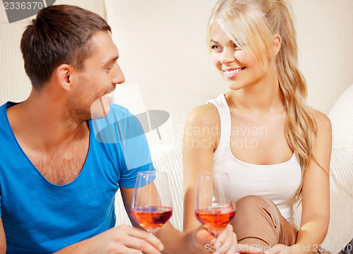 Image of romantic couple drinking wine