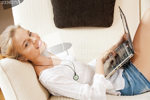 Image of happy teenage girl with laptop computer