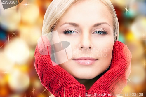 Image of beautiful woman in red mittens