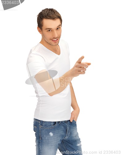 Image of man in white shirt pointing his finger