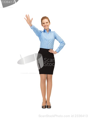 Image of stewardess making greeting gesture