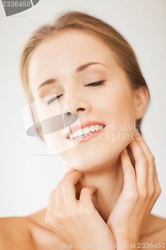 Image of face and hands of beautiful woman
